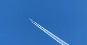 Airplane in clear blue sky